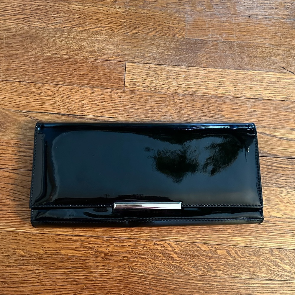 Stuart Weitzman black patent clutch
